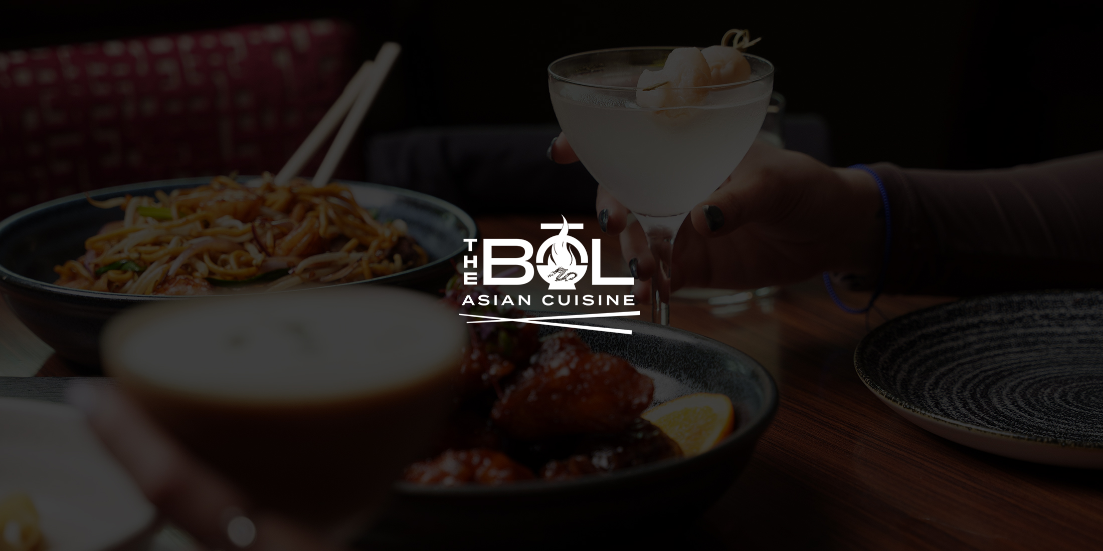 people at a table with food and drink at the bol restaurant in the hard rock hotel